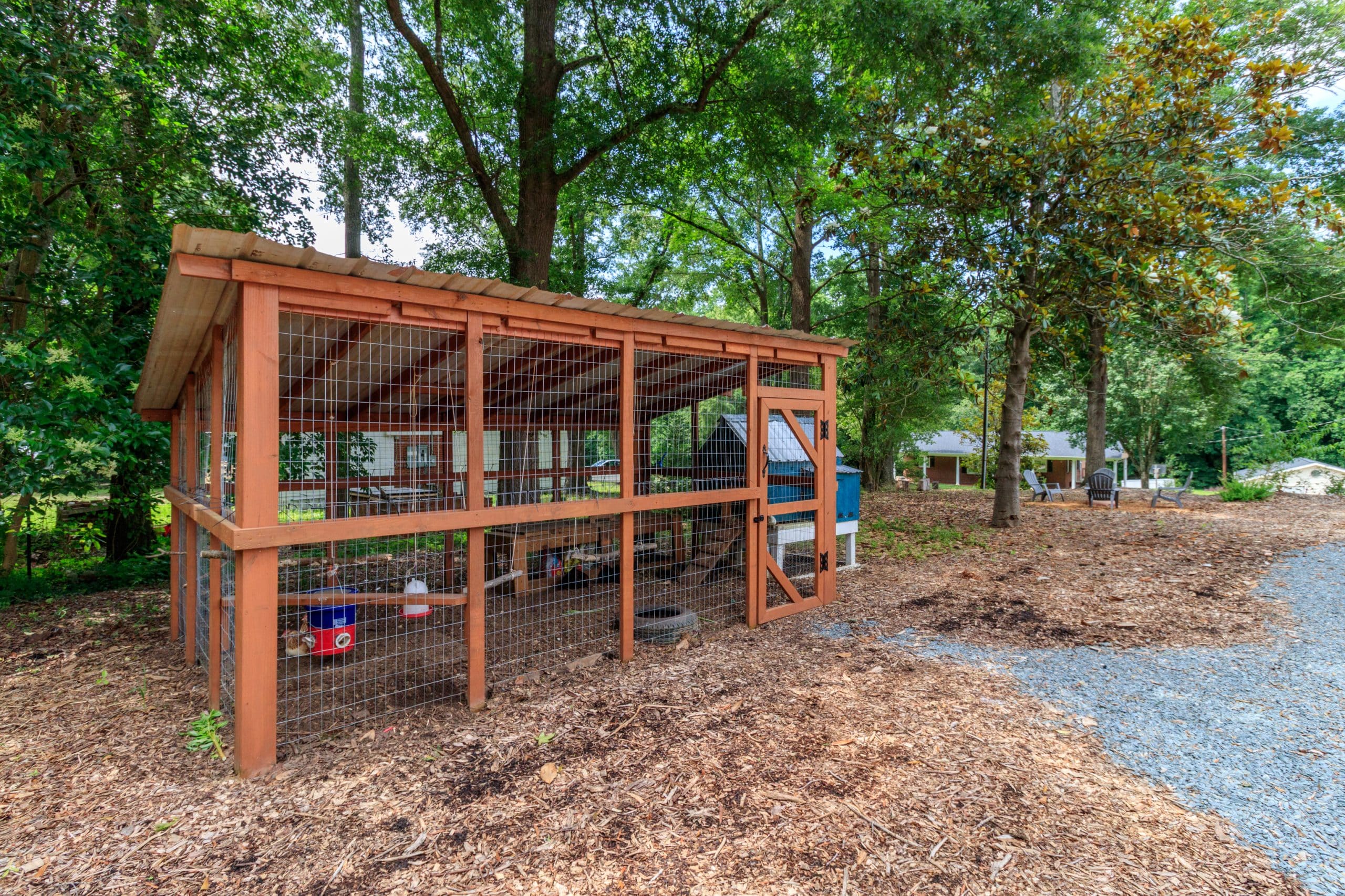 Cottage home in Indian Land with edible gardens, raised beds, chicken coop, yoga deck, and mature trees near Ballantyne.