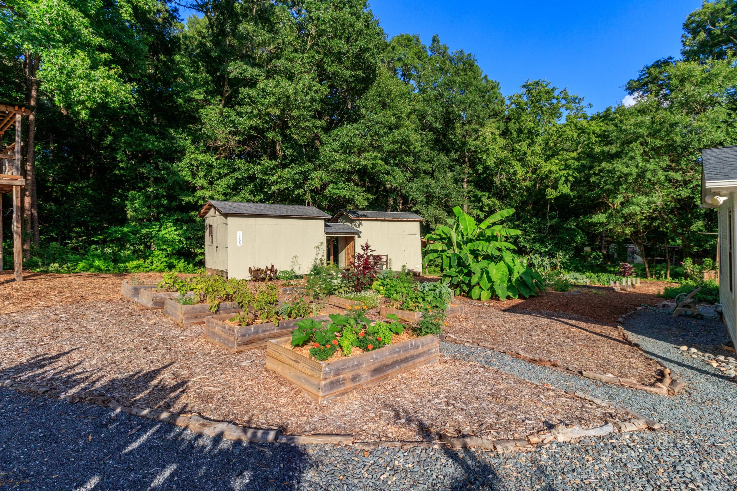 Cottage home in Indian Land with edible gardens, raised beds, chicken coop, yoga deck, and mature trees near Ballantyne.