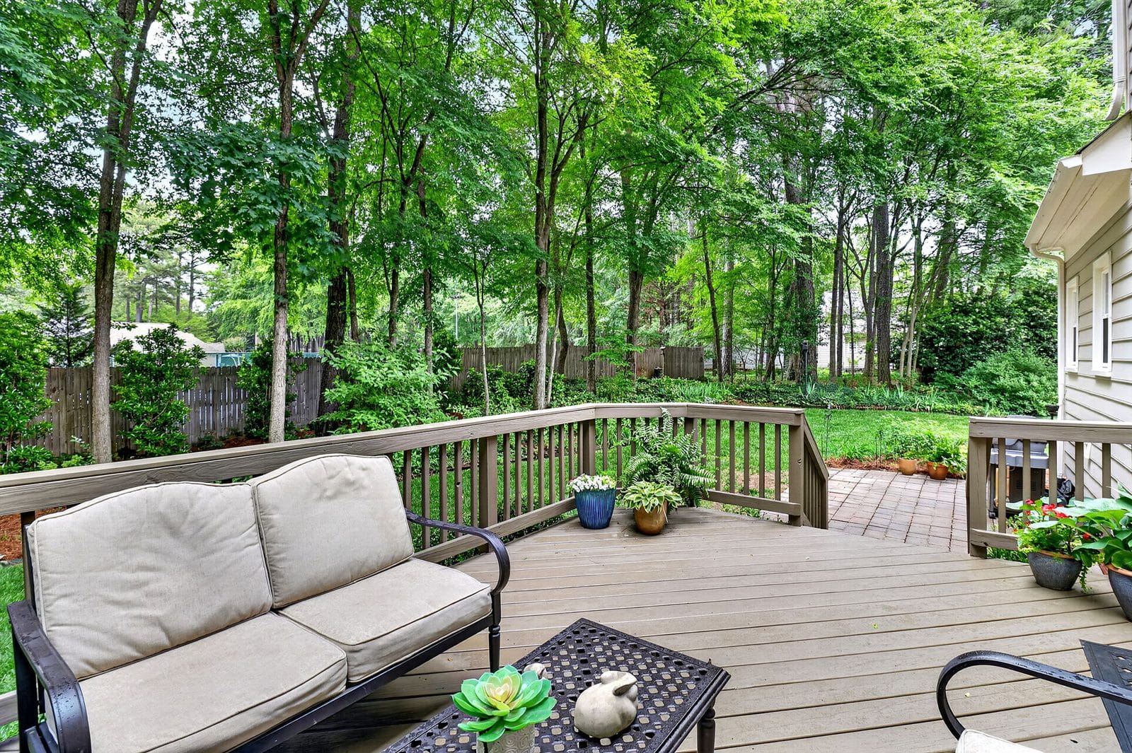 Outdoor deck overlooking backyard