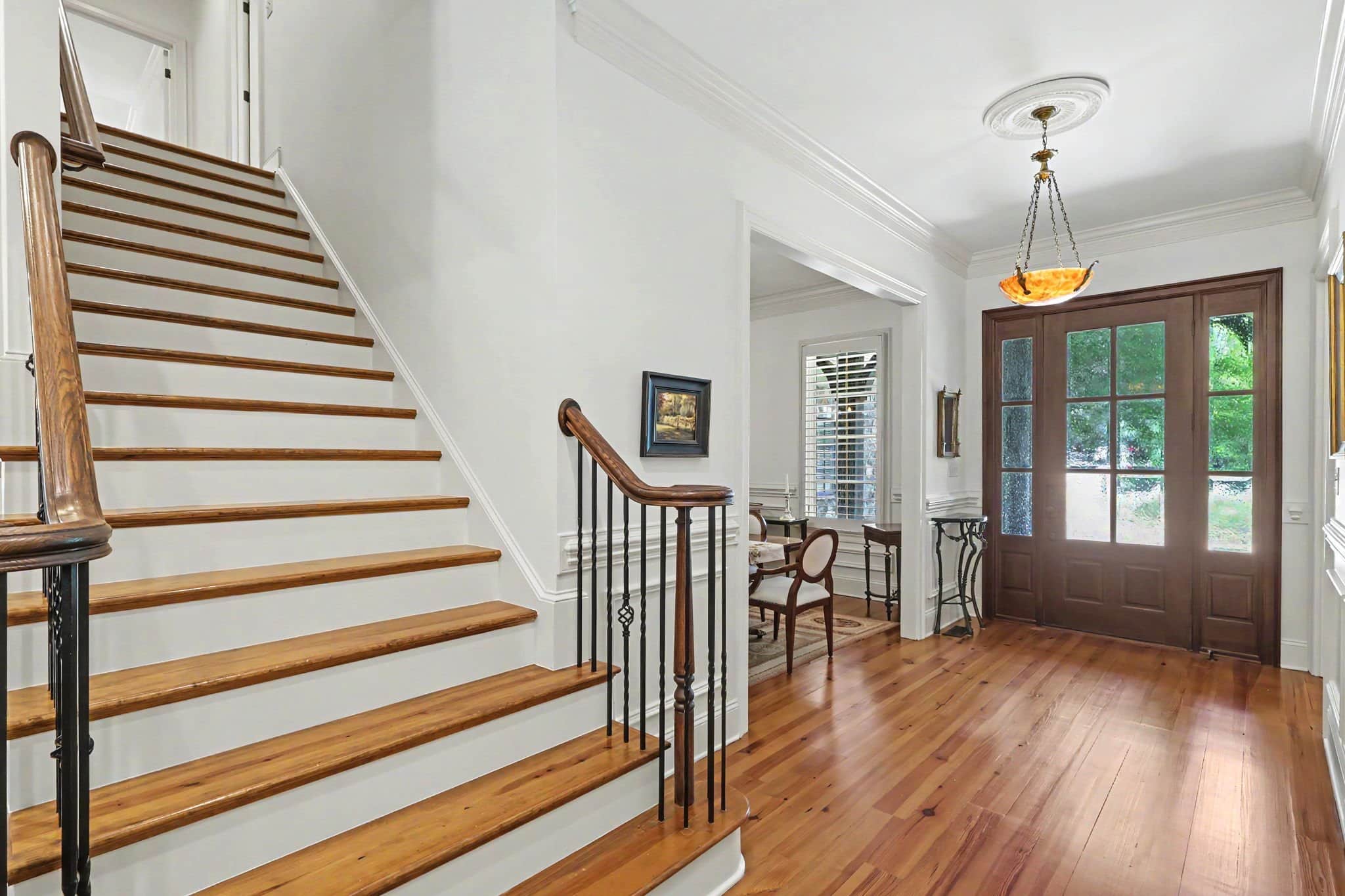 Ornate chandelier in the foyer of 508 Hideaway Ridge Court with heart of pine floors