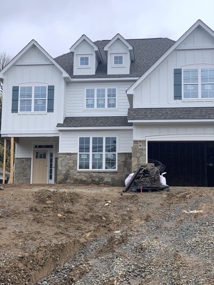New construction home under construction with framing visible